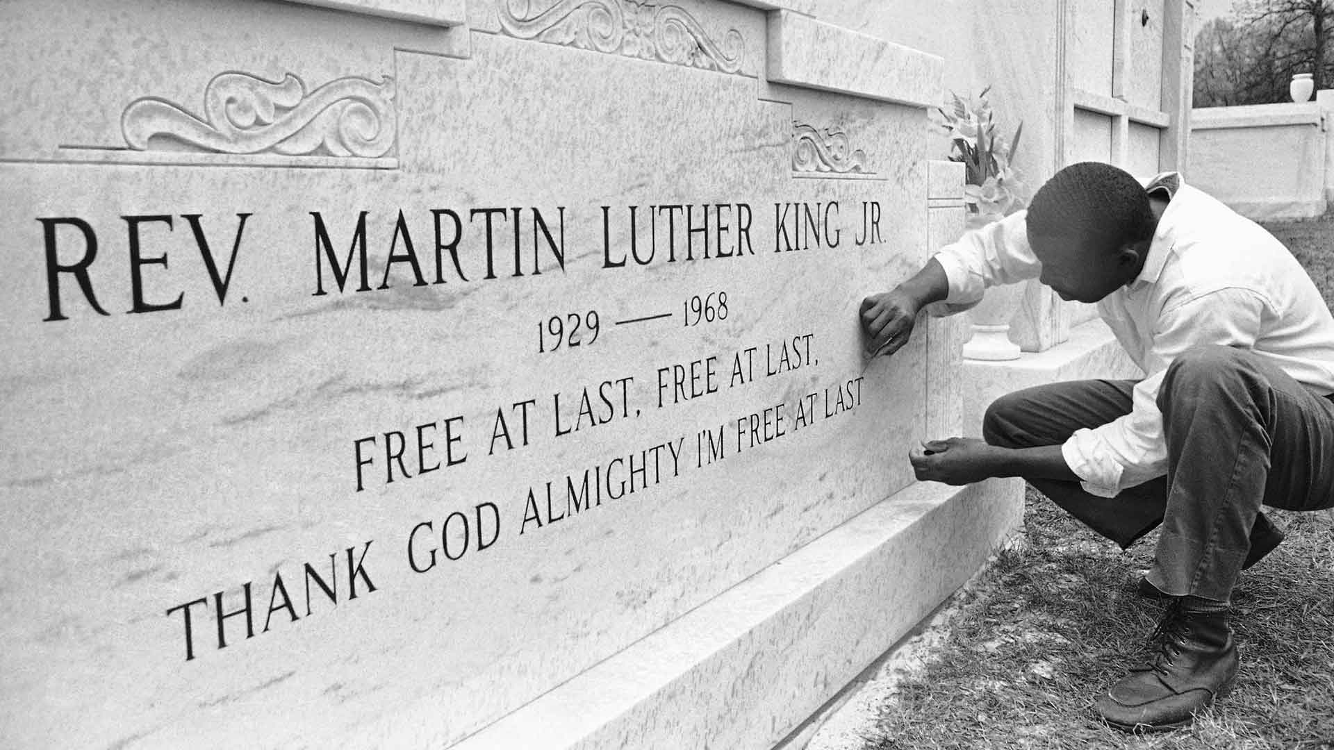 Charles Arnold touches up the lettering which was stenciled on the crypt of Dr. Martin Luther King in Atlanta on April 8, 1968. (AP Photo/Charles Kelly)